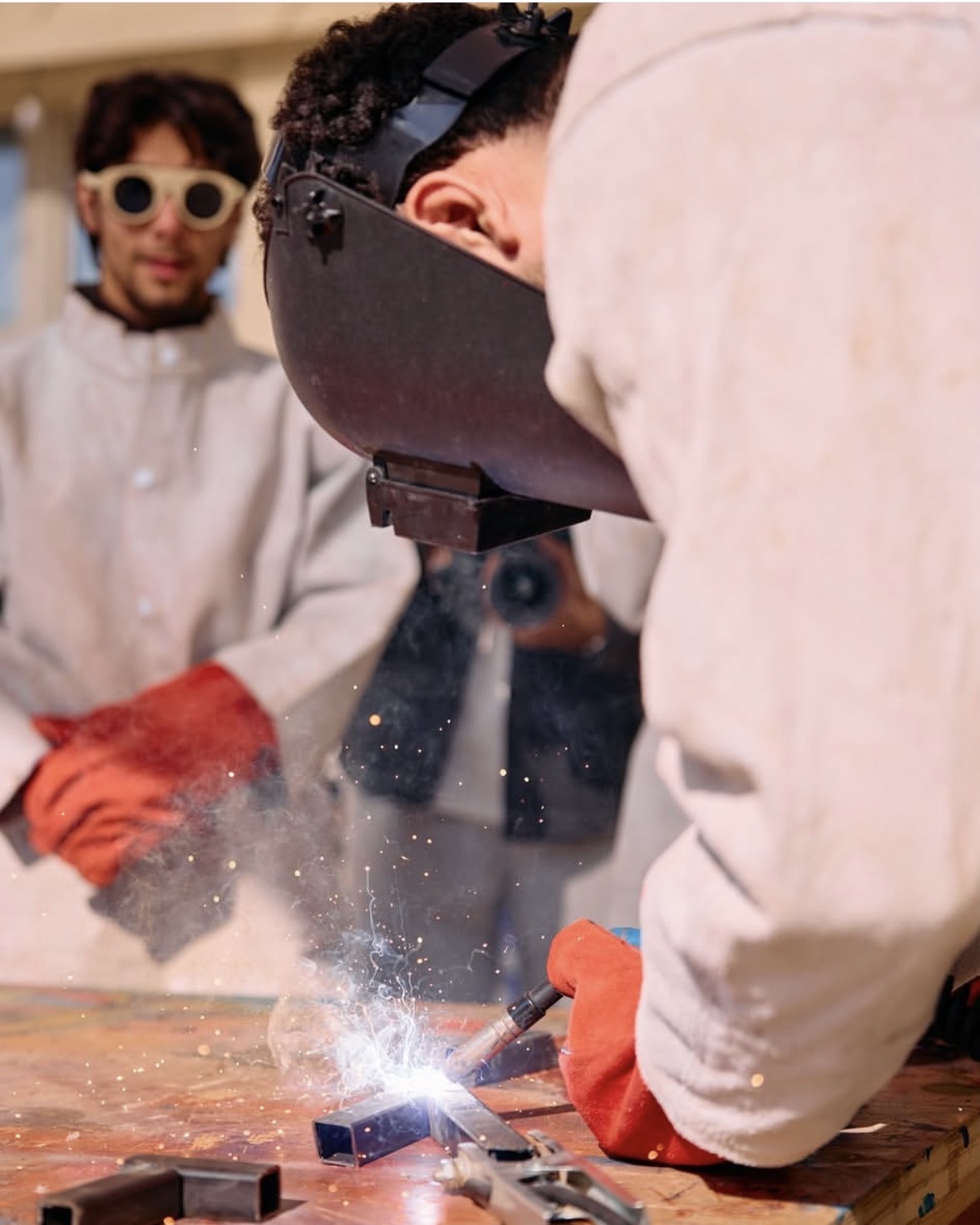 Striking an arc on the chassis, sparks coming off the weld