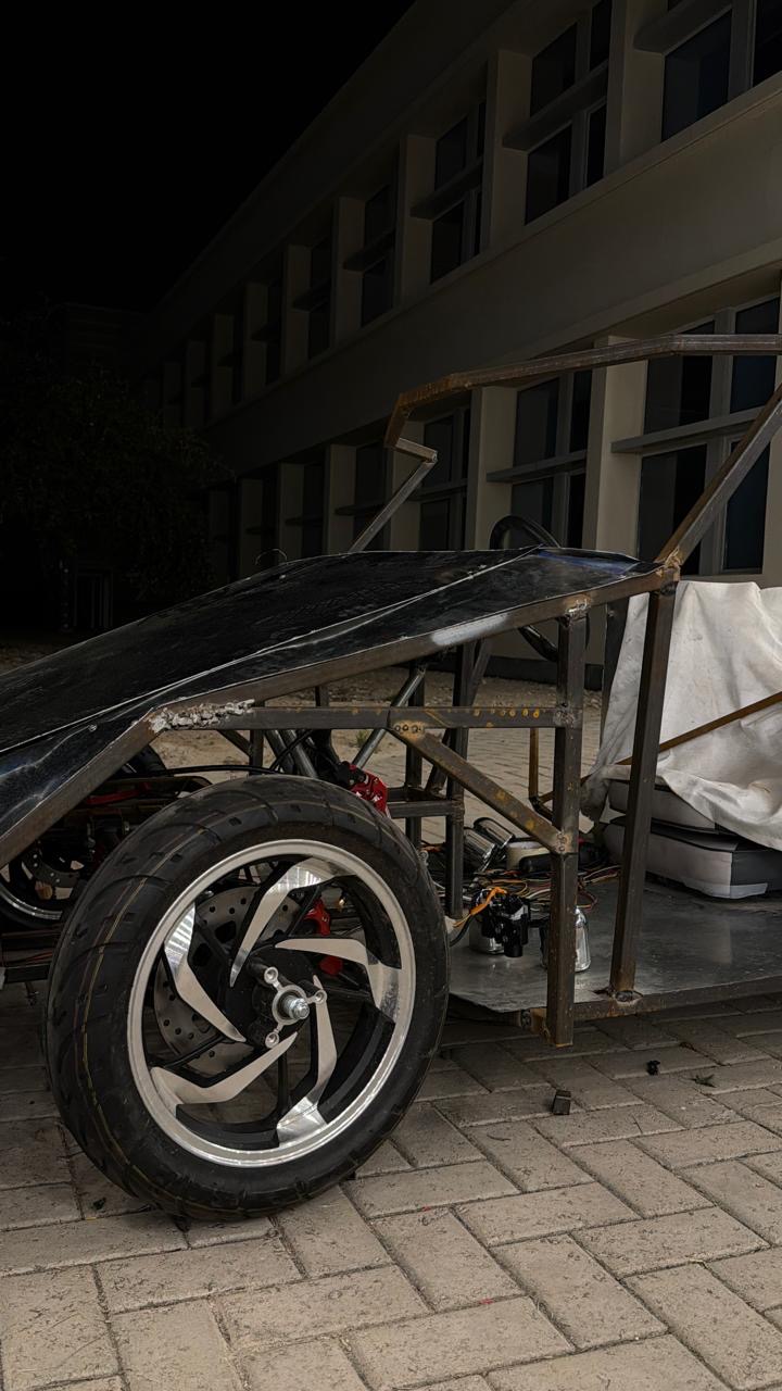 The first black body panel going onto the bare frame