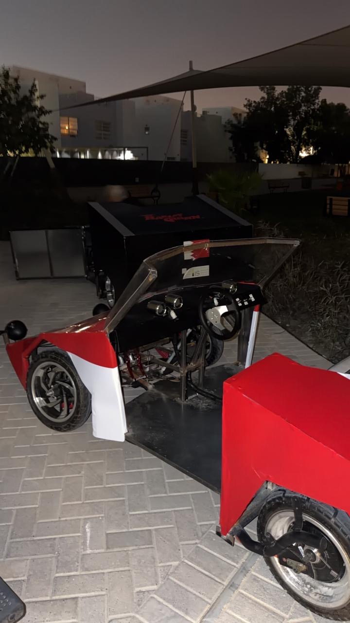 The finished red and white car, dash and gauges in